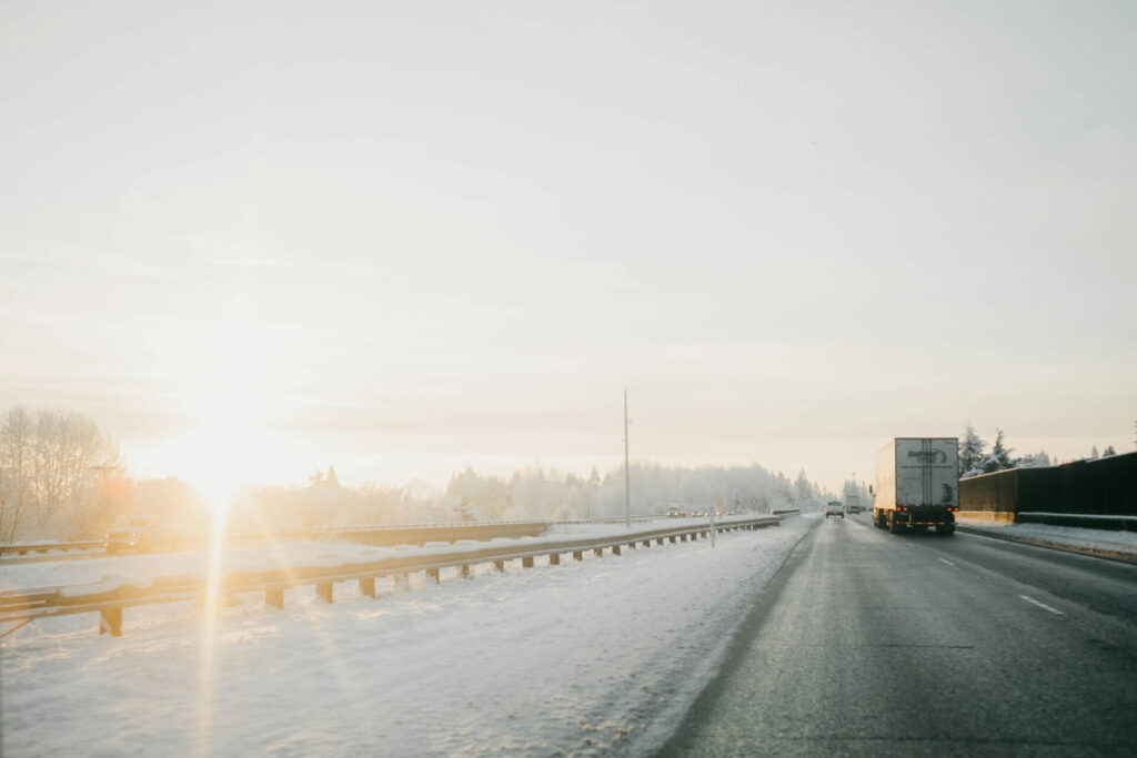 Delivery truck driving on winter icy roads